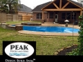Freeform Pool with Tanning Ledge and Patio Cover