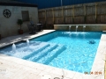 Geometric Pool with Raised Scupper Wall and Tanning Ledge