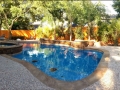 Freeform Pool with Raised Spa and Wall